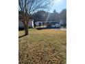 Large backyard with a shed and parking area at 230 Highland Blvd, Stockbridge, GA 30281