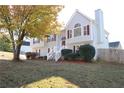 Two-story house with gray siding, white stairs, and landscaping at 6298 Hampstead Ln, Douglasville, GA 30134