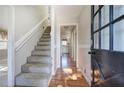 Bright entryway with hardwood floors and staircase at 911 S Lassetter Cir, Villa Rica, GA 30180