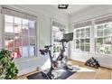 Home gym with Peloton bike and weights, near large windows at 204 Heatherdown Rd, Decatur, GA 30030