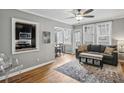 Bright living room, hardwood floors, open kitchen, and balcony access at 1072 Piedmont Ne Ave # 108, Atlanta, GA 30309