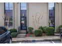 Townhouse entrance with landscaping and parking at 15 Ivy Ne Sq, Atlanta, GA 30342