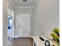 Bright foyer with hardwood floors and view into the living room at 5732 Cypress Bluff Ln, Hoschton, GA 30548