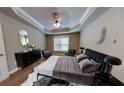 Relaxing bedroom with a plush bed, dresser, and ceiling fan at 1209 Watson Se Trl # 117, Atlanta, GA 30316