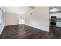 Open concept living room with kitchen access and vinyl flooring at 4404 Mercer Rd, Decatur, GA 30035