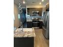 Modern kitchen with stainless steel appliances and granite countertops at 759 Jones Nw Ave, Atlanta, GA 30314