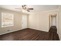 Spacious living room with dark wood-look floors and neutral walls at 896 Meadow Rock Way, Stone Mountain, GA 30083