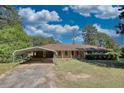 Front view of a single-Gathering home with a carport and driveway at 11790 Brown Bridge Rd, Covington, GA 30016