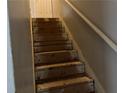 Unfinished wood staircase with exposed subflooring at 2390 Burdett Ridge Dr, Atlanta, GA 30349