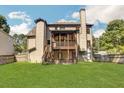 Two-story house with a large deck and fenced backyard at 1054 Sunny Field Ln, Lawrenceville, GA 30043