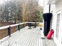 Spacious deck with seating area, offering a peaceful backyard view at 1563 Bailey Farms Dr, Lawrenceville, GA 30043