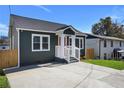 Updated home with gray siding, white trim, and a welcoming front porch at 541 Sunset Nw Ave, Atlanta, GA 30318