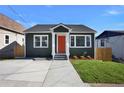 Recently renovated home featuring gray siding, a new driveway, and well-manicured lawn at 541 Sunset Nw Ave, Atlanta, GA 30318