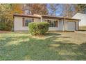 House exterior showcasing a well-maintained lawn at 5267 Tasman Trl, Lithonia, GA 30038