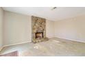 Living room featuring a stone fireplace at 5267 Tasman Trl, Lithonia, GA 30038