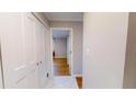 Clean hallway with hardwood floors and access to bedrooms at 300 Johnson Ferry Ne Rd # B611, Atlanta, GA 30328