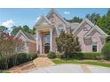 Two-story brick home with columns and stone walkway at 2225 Johnson Ferry Rd, Marietta, GA 30062