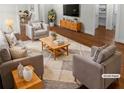 Virtually staged living room featuring hardwood floors and neutral color palette at 2320 Capehart Ne Cir, Atlanta, GA 30345