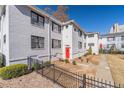 White brick building with red door and landscaped grounds at 99 Peachtree Memorial Nw Dr # D3, Atlanta, GA 30309