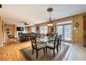 Open dining area with glass table and access to the living room at 1067 Preserve Park Dr, Loganville, GA 30052