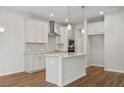 Modern kitchen with island, stainless steel appliances, and white cabinets at 1060 Rose Dr, Marietta, GA 30060