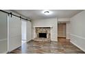 Gathering room with stone fireplace and barn-style sliding doors at 2193 Hampton Se Trl, Conyers, GA 30013