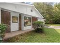 Front entrance with brick facade and white door at 2616 Landington Nw Way, Duluth, GA 30096