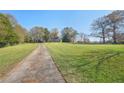 Long driveway leading to charming two-story home at 14299 Highway 36, Covington, GA 30014