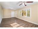 Bright living room with hardwood floors and large windows at 1425 Cobb Branch Dr, Decatur, GA 30032