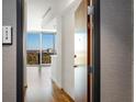 Entryway with hardwood floors and view to living room and city at 361 17Th Nw St # 1618, Atlanta, GA 30363