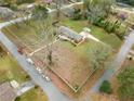 Aerial view of ranch house, expansive lot, and tree-lined street at 3645 Aldea Dr, Decatur, GA 30032
