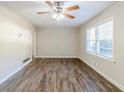 Spacious living area with hardwood floors and large windows at 2543 Brentwood Rd, Decatur, GA 30032