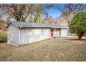 Gray sided ranch home with red front door and large yard at 193 Polar Rock Sw Rd, Atlanta, GA 30315