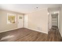 Living room with hardwood floors, neutral walls and an exterior door at 193 Polar Rock Sw Rd, Atlanta, GA 30315