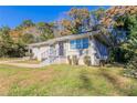 Brick ranch home with a landscaped yard and walkway at 4252 Lamar St, Decatur, GA 30035
