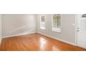 Bright living room with hardwood floors and neutral walls at 676 Tarkington S Rd, Stone Mountain, GA 30088