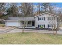 Brick ranch home with a carport and landscaped yard at 3986 Holland Dr, Douglasville, GA 30135