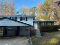Brick ranch home with carport, steps, and landscaping at 5423 Pine Valley Dr, Union City, GA 30291