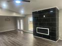 Modern living room with fireplace and hardwood floors at 1312 Buttercup Ct, Lawrenceville, GA 30044