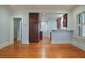 Hardwood floors, light blue walls, and kitchen view at 1125 Briarcliff Ne Pl # 1, Atlanta, GA 30306