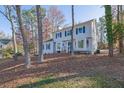 Two-story house with gray siding, blue shutters, and a landscaped yard at 3070 Branford Ct, Marietta, GA 30062