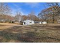 Backyard view with trees and additional buildings at 2948 Lenora Rd, Snellville, GA 30039