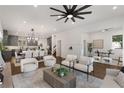 Open concept living room with hardwood floors, white sofas, and a modern coffee table at 60 Newcastle Sw St, Atlanta, GA 30314