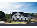 Community clubhouse and pool area with modern farmhouse style at 2108 Stillhaven Pl, Douglasville, GA 30135