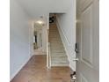 Bright entryway with hardwood floors and staircase leading upstairs at 510 Jefferson Chase St, Atlanta, GA 30354
