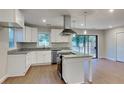 Modern kitchen with white cabinets, granite countertops, and stainless steel appliances at 1864 Pinedale Pl, Decatur, GA 30032