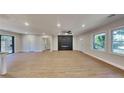 Spacious living room featuring hardwood floors and a modern fireplace at 1864 Pinedale Pl, Decatur, GA 30032