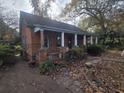 Brick home with covered porch and side yard at 43 Gammon Se Ave, Atlanta, GA 30315