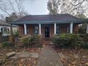 Brick home with covered porch and landscaped yard at 43 Gammon Se Ave, Atlanta, GA 30315