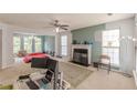 Spacious living room with a fireplace and large windows at 5439 Village Rdg, Fairburn, GA 30213